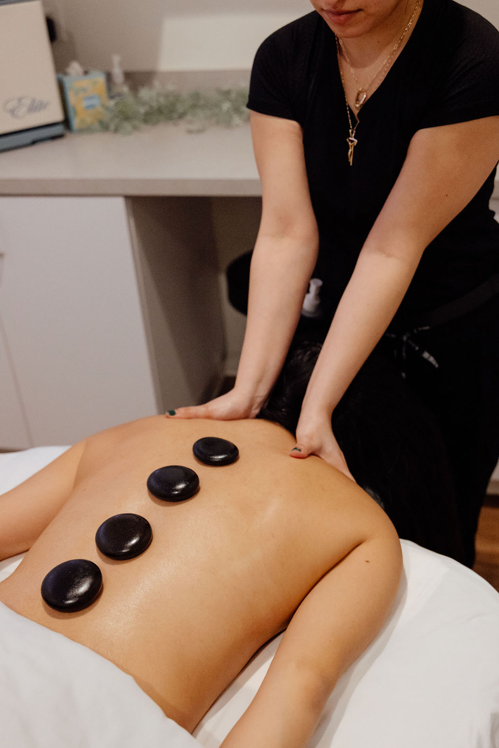 a bare necessities therapist doing a massage in houston
